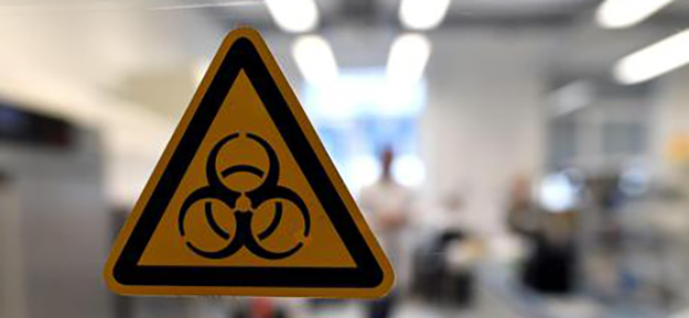 A 'Biological Hazard' sign in Duesseldorf, Germany, 08 November 2016. The State Environmental Agency of North Rhine-Westphalia has unveiled a special laboratory purpose-built for the study of Legionella. The new research facility is the first belonging to the state designed for the examination of the dangerous bacteria. EPA/FEDERICO GAMBARINI